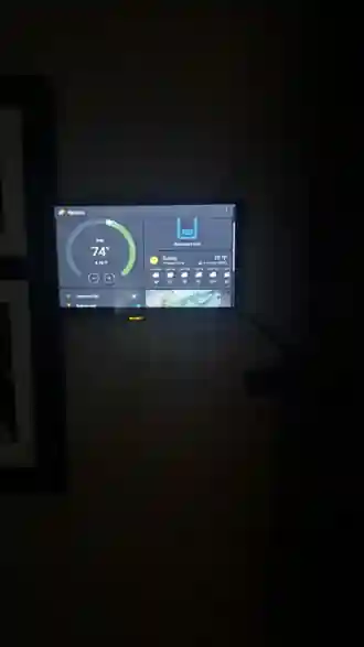 Home Assistant touchscreen showing upstairs temperature and downstairs heat.